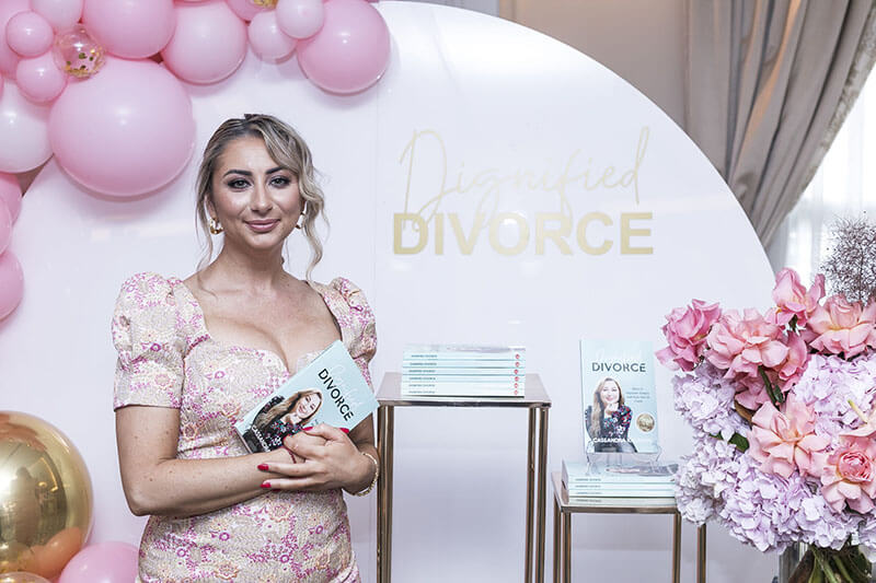 Cassandra holding book dignified divorce